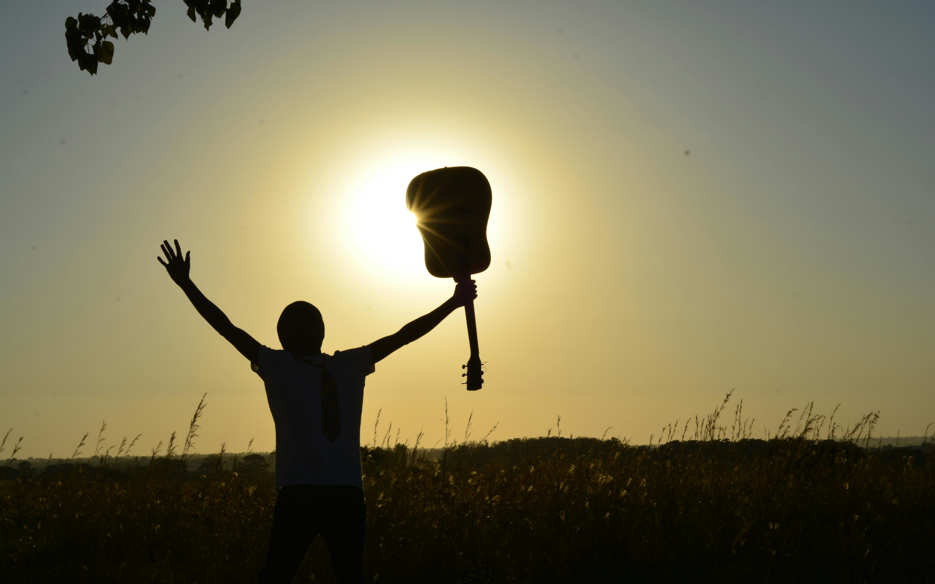 Man holding up a guitar