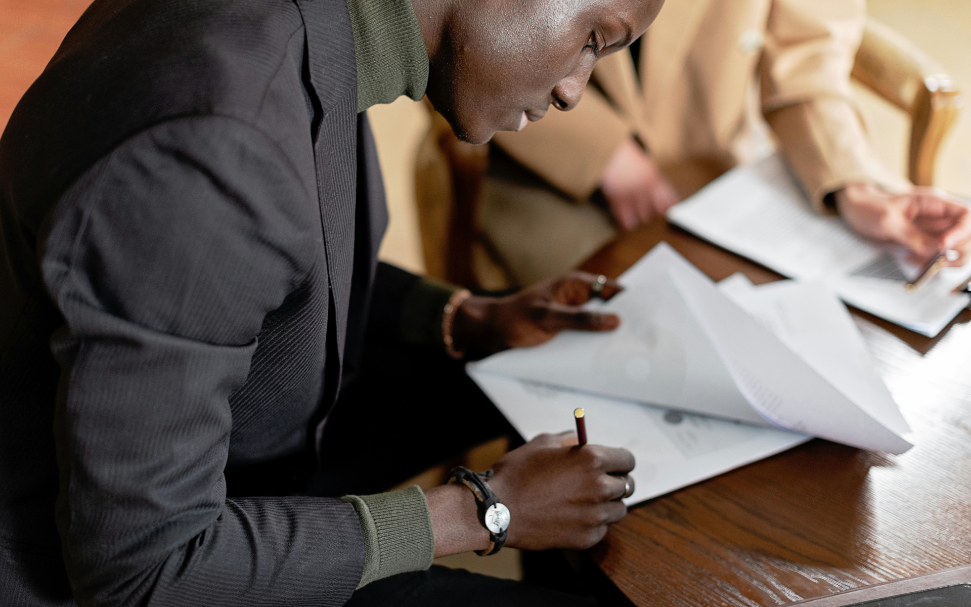 Man signing a contract